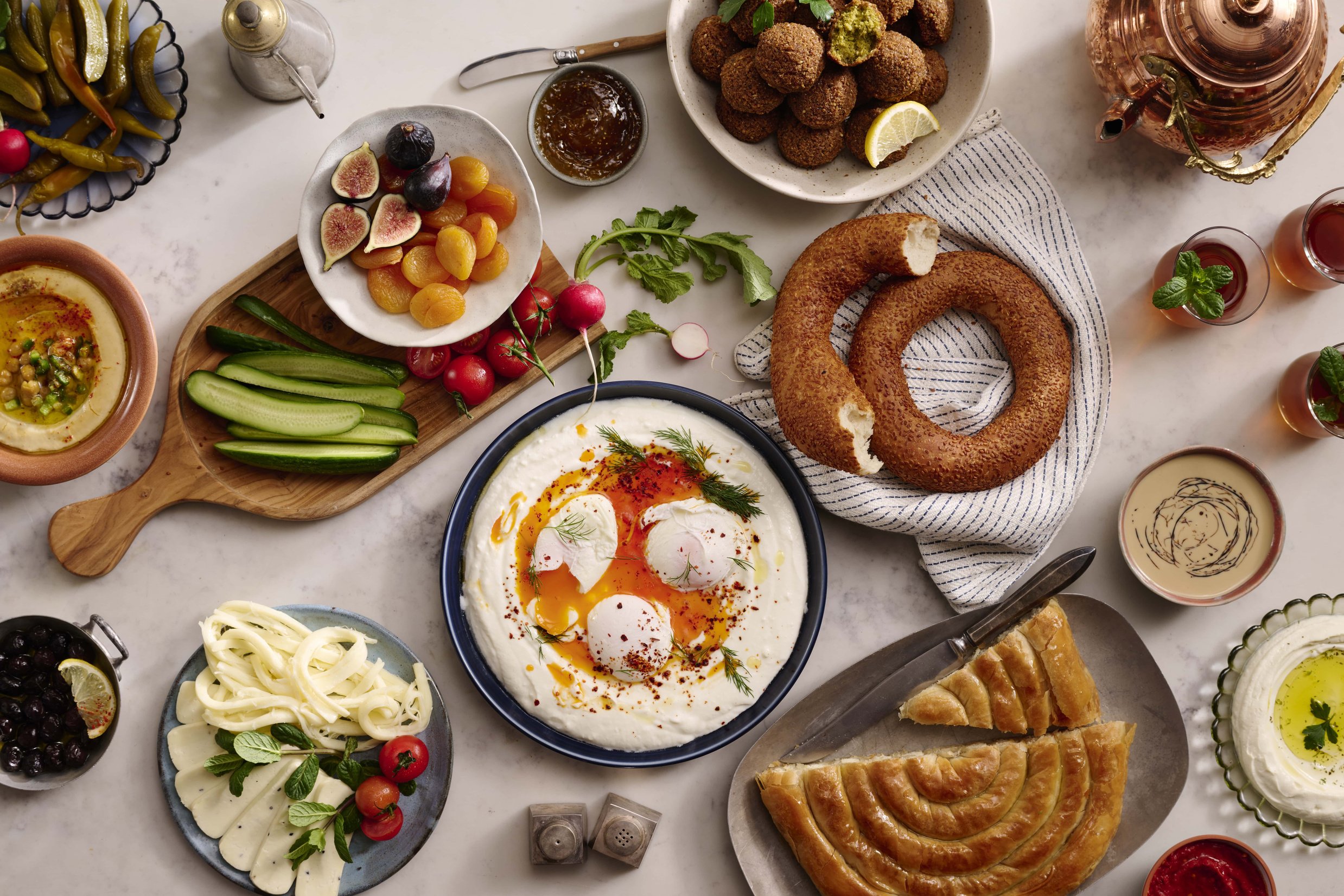 an assortment of Turkish foods shown on a table